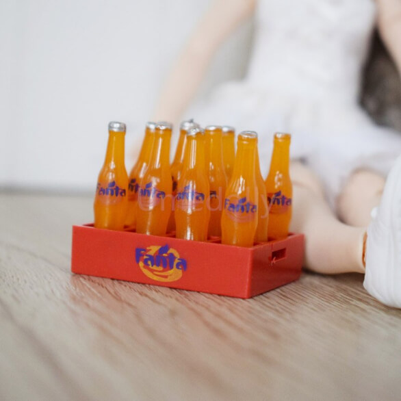 12 Miniature Fanta Orange Soda Bottles in a Crate